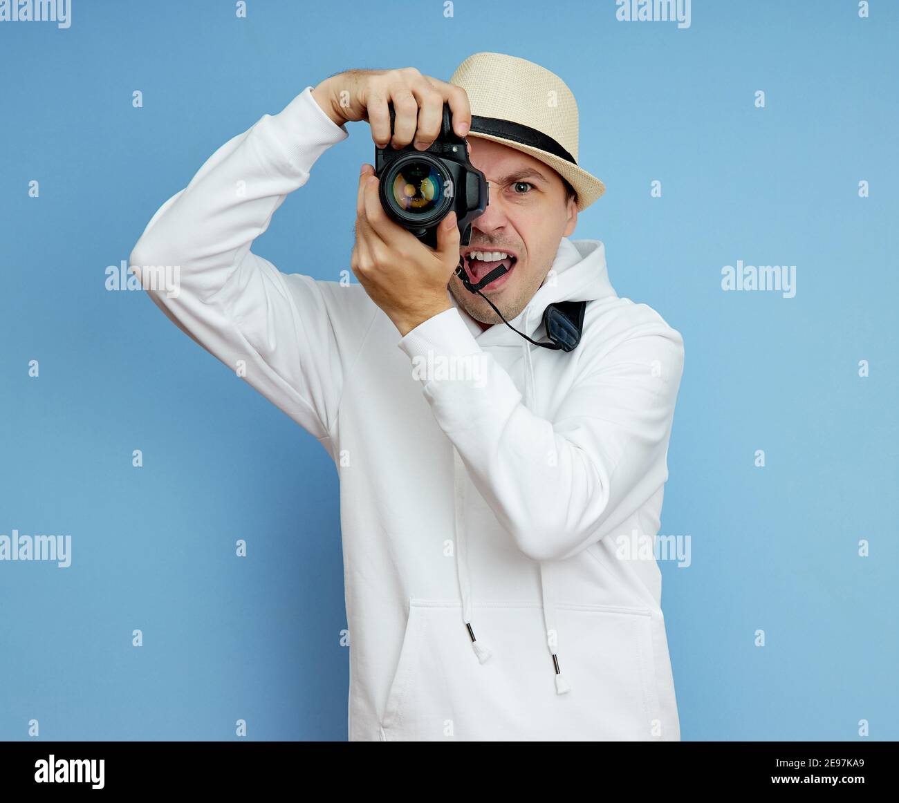 Man photographer with a SLR camera in his hands takes photos Stock ...