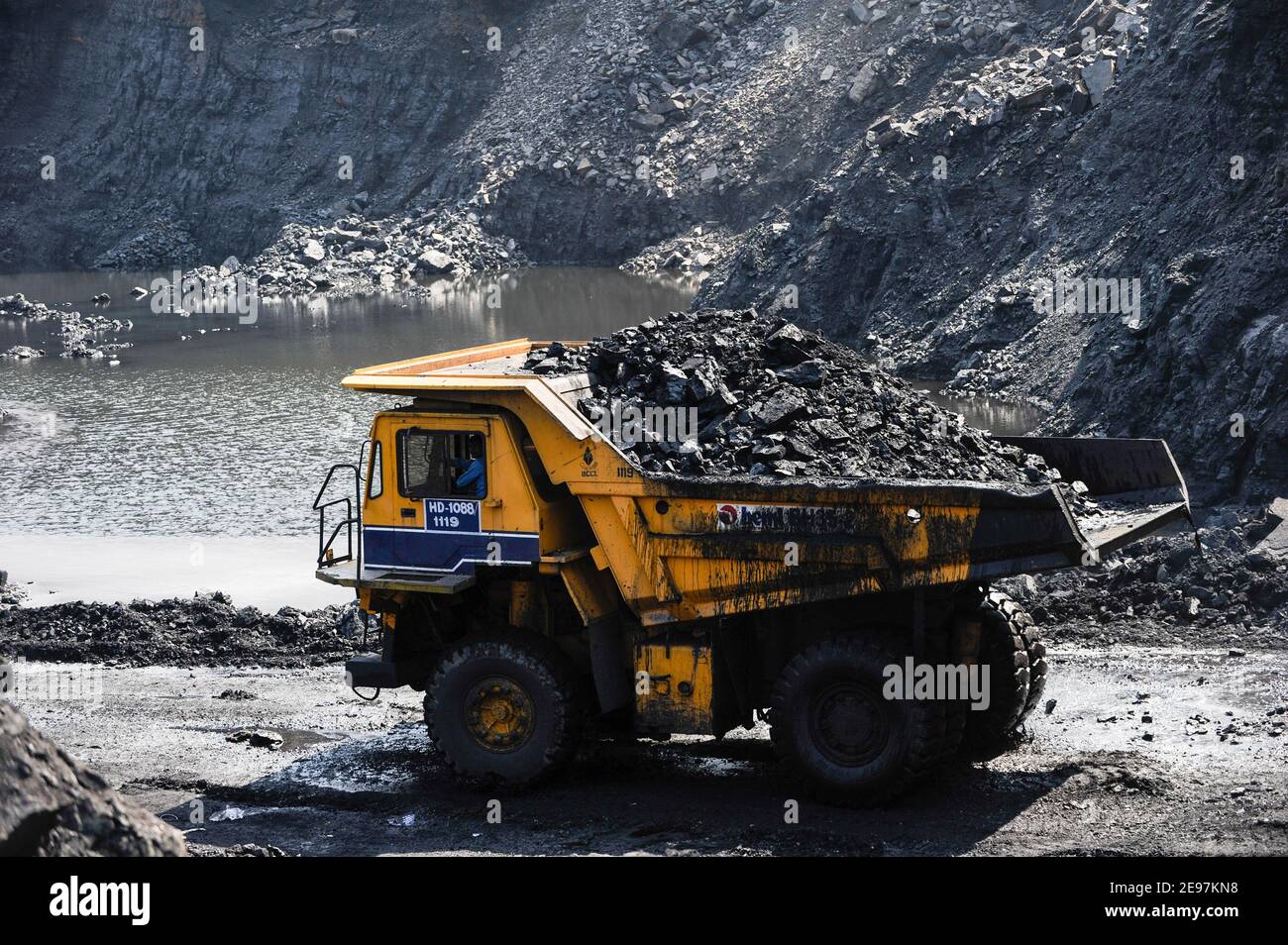 INDIA Dhanbad, open-cast coal mining of BCCL Ltd a company of COAL INDIA, large BEML dumper for coal transport from the mine / INDIEN Dhanbad , offener Kohle Tagebau von BCCL Ltd. ein Tochterunternehmen von Coal India Stock Photo