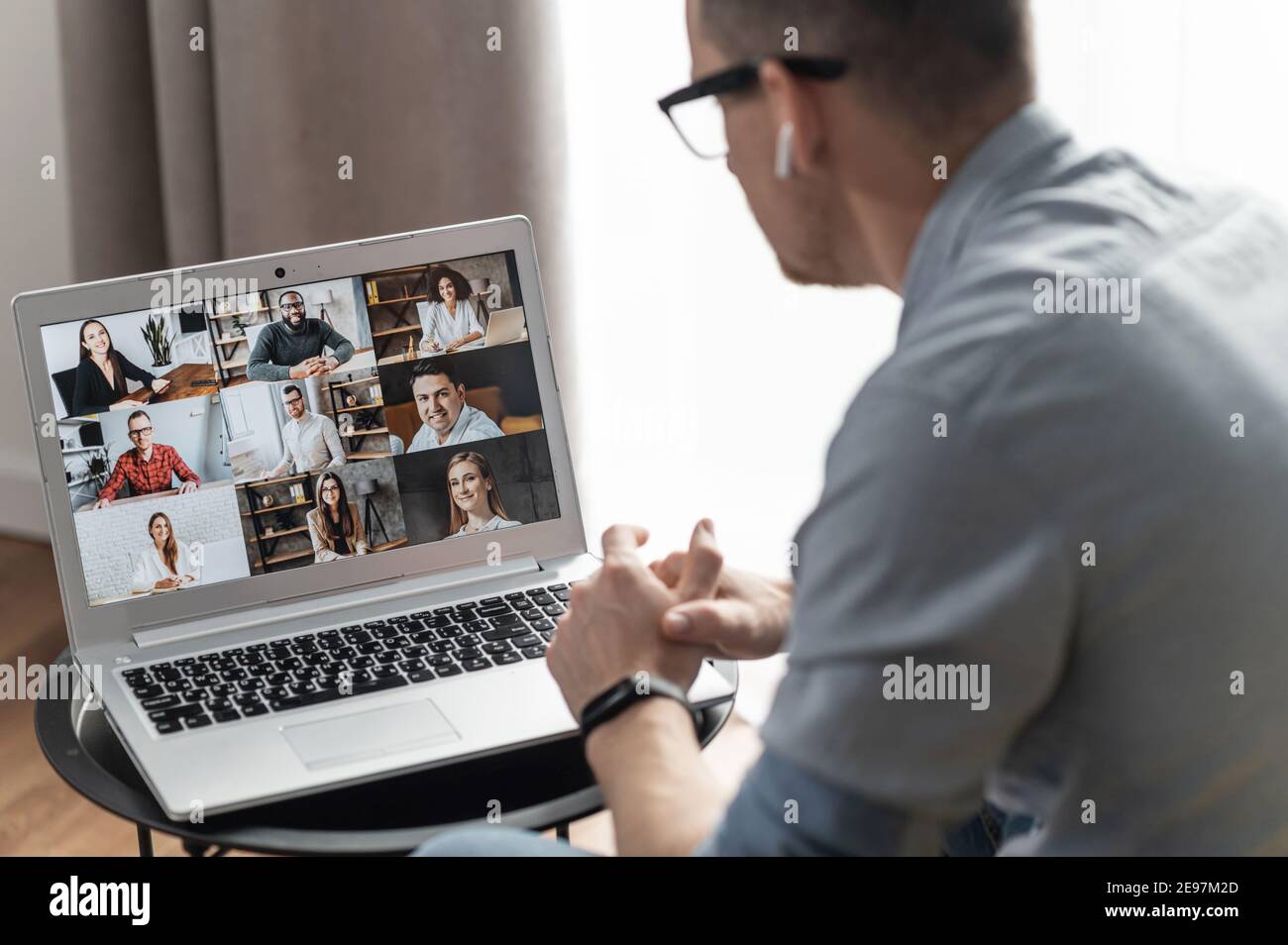 Business meeting on the distance. Businessman talking with a partners, discussing about solving tasks and strategy of development. A multiracial team Stock Photo