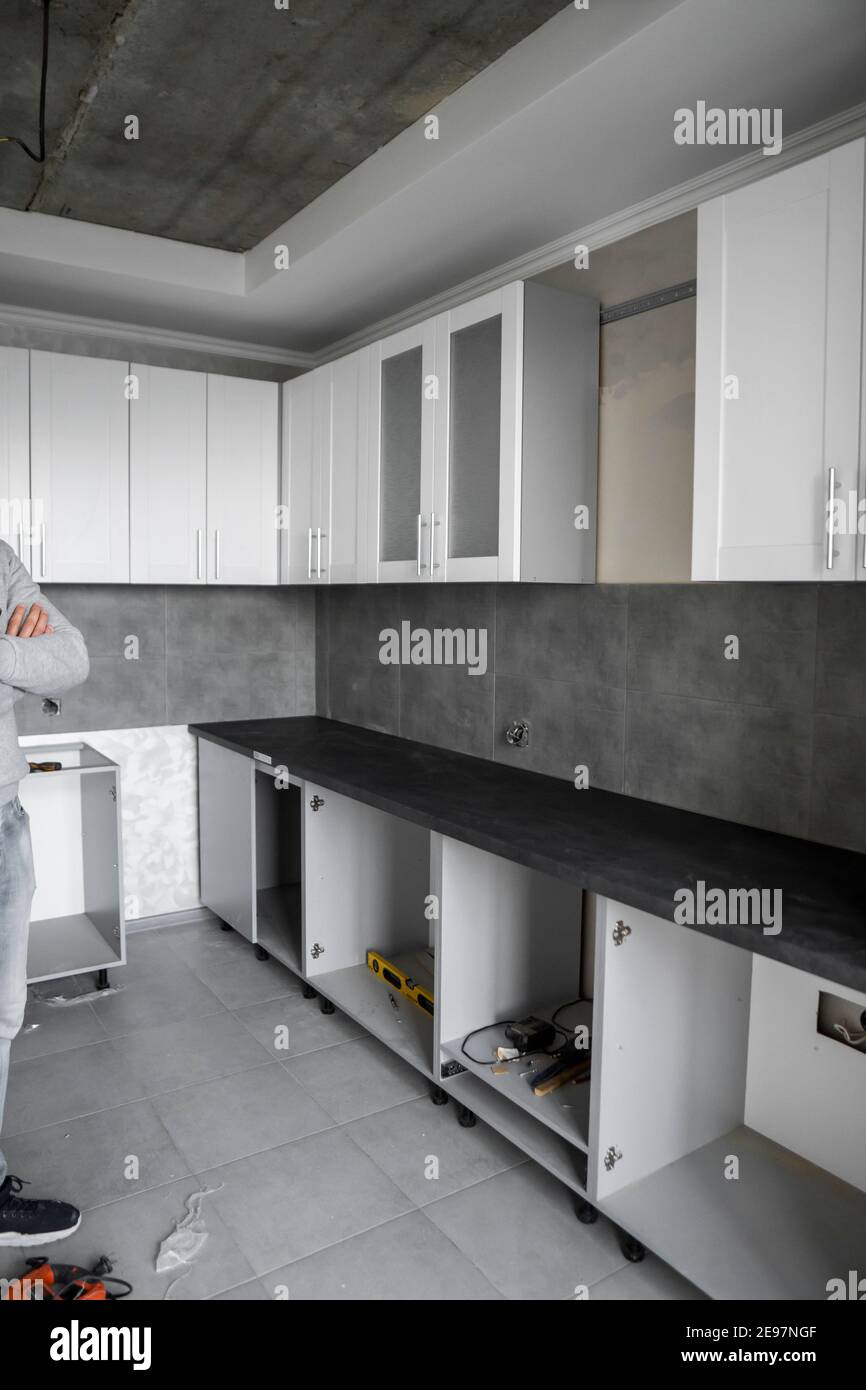 Custom kitchen installation with a white furniture facades mdf