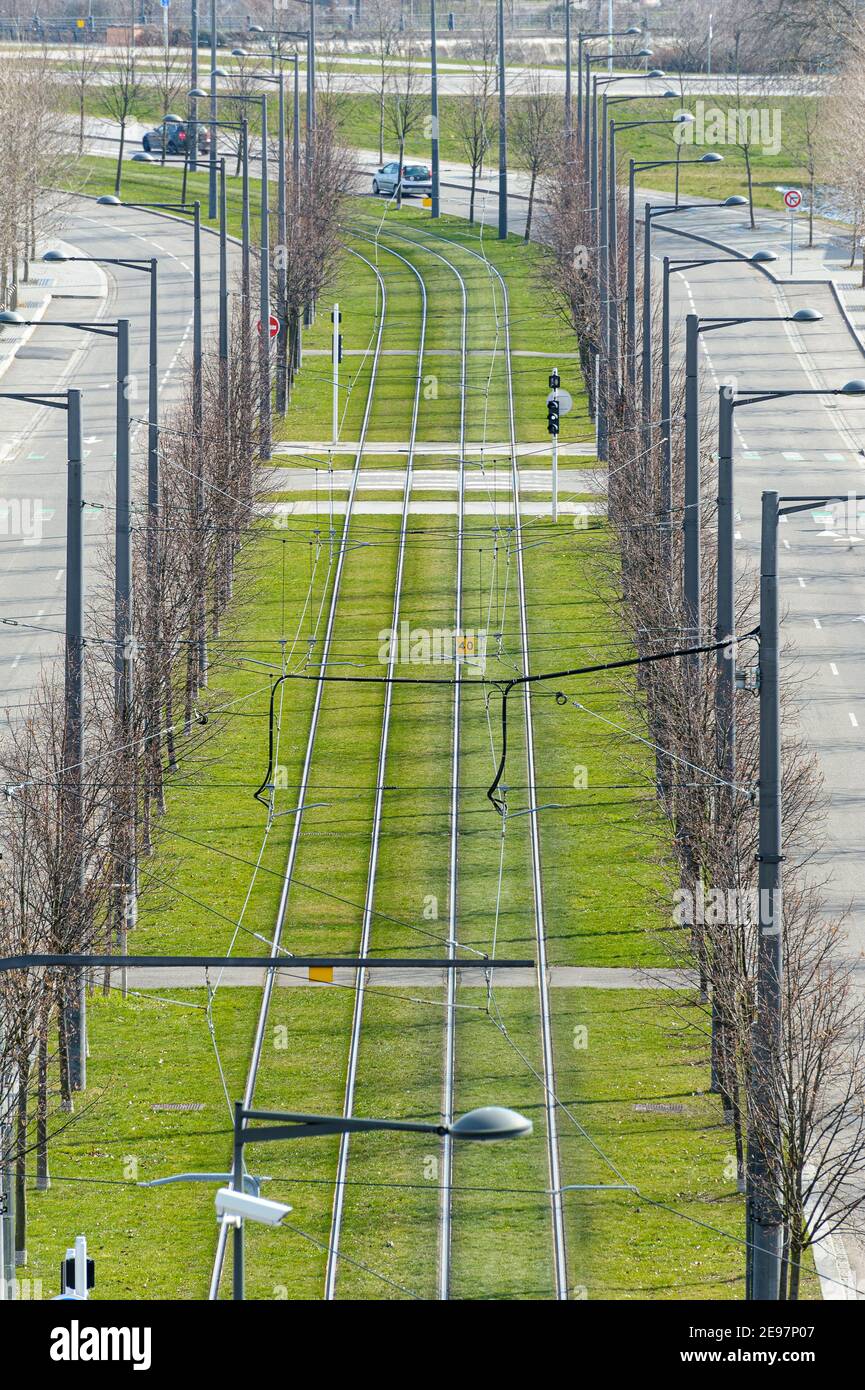 Streetcar line in Strasbourg, France. - View from a terrace of a tramway line laid out with grass. Stock Photo