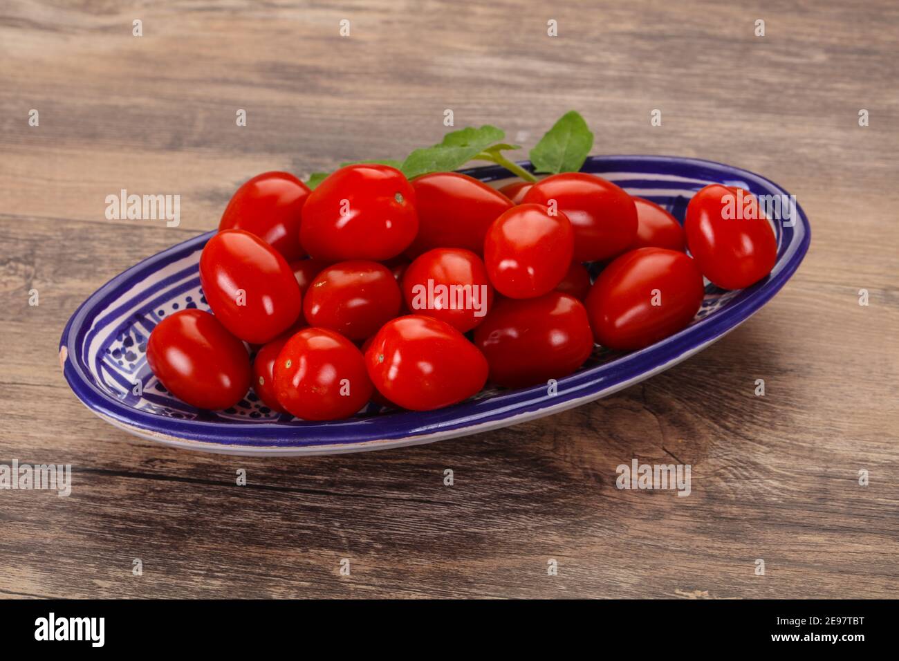Sweet Red cherry tomatoes in the bowl Stock Photo - Alamy