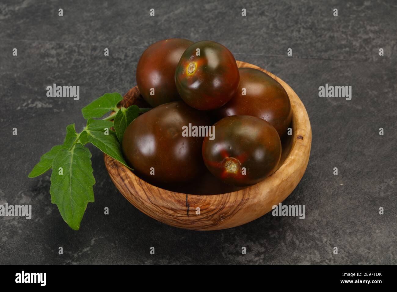 Black tomato tasty fresh ripe Kumato Stock Photo Alamy