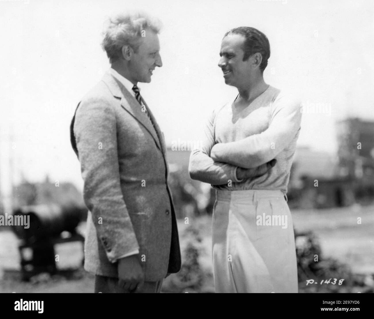 Visitor LEOPOLD STOKOWSKI ( conductor of the Philadelphia Symphony Orchestra ) with DOUGLAS FAIRBANKS Sr on set candid during filming of THE GAUCHO 1927 director F. RICHARD JONES story Douglas Fairbanks ( as Elton Thomas) Elton Corporation / United Artists Stock Photo