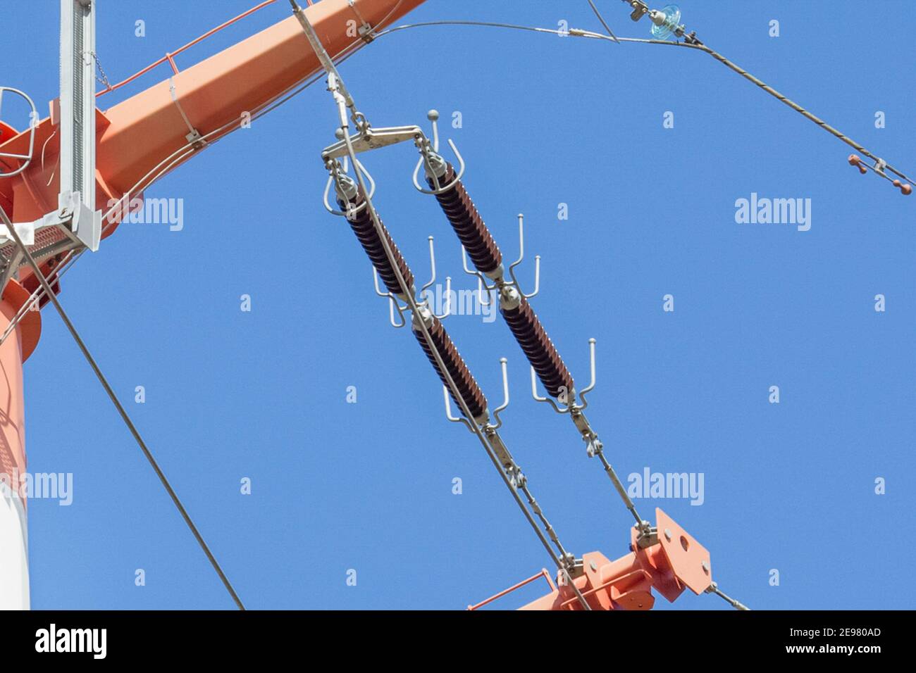 Glass insulators on highvoltage power line poles Stock Photo Alamy