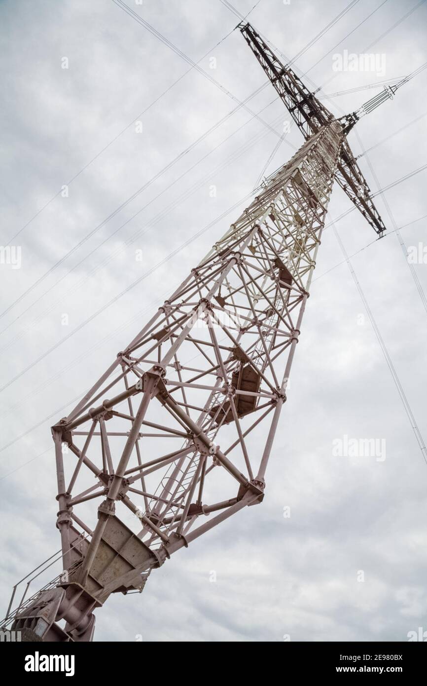 Glass insulators on high-voltage power line poles Stock Photo - Alamy