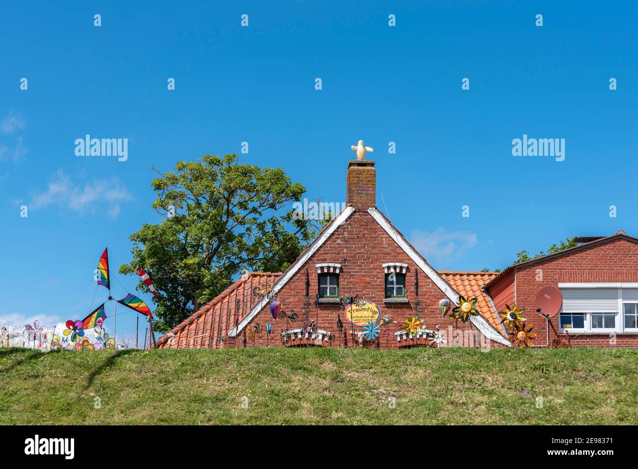traditional Houses in Harbor of Greetsiel in East Frisia at North Sea,lower Saxony,Germany Stock Photo