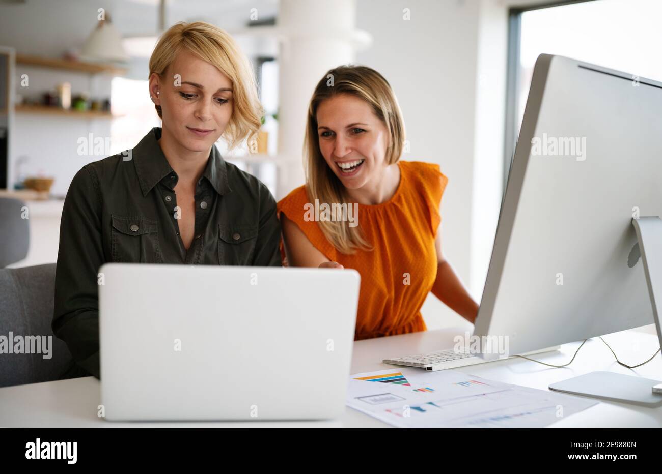 Happy business women working together at office Stock Photo - Alamy