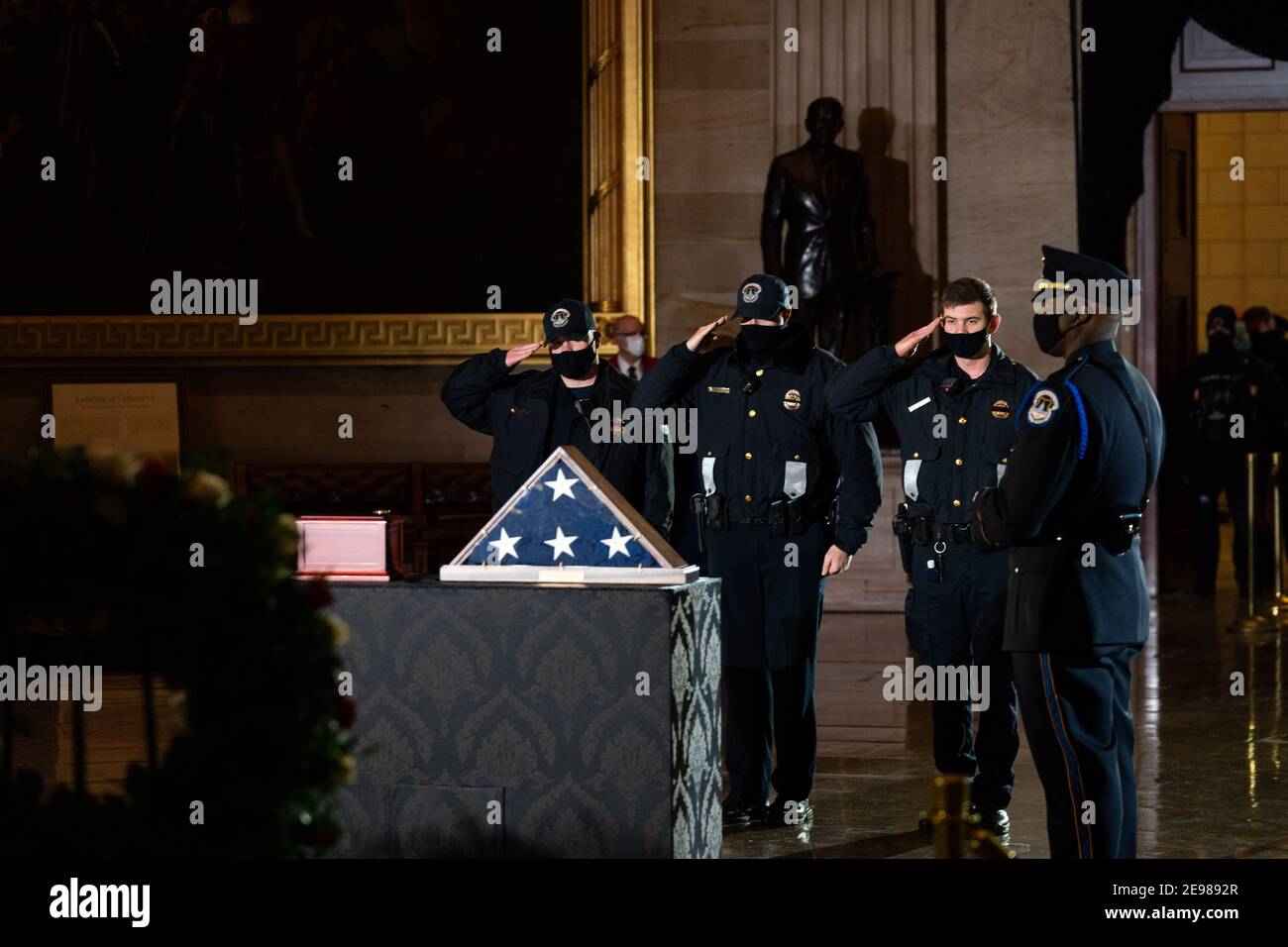 Washington, United States. 03rd Feb, 2021. Capitol Police Officers pays his respects to Officer Brian Sicknick, who died from injuries sustained during the January 6th insurrection and whose remains were brought to lie in honor in the Capitol Rotunda, at the Capitol in Washington on February 3rd, 2020. Pool Photo by Anna Moneymaker/UPI Credit: UPI/Alamy Live News Stock Photo