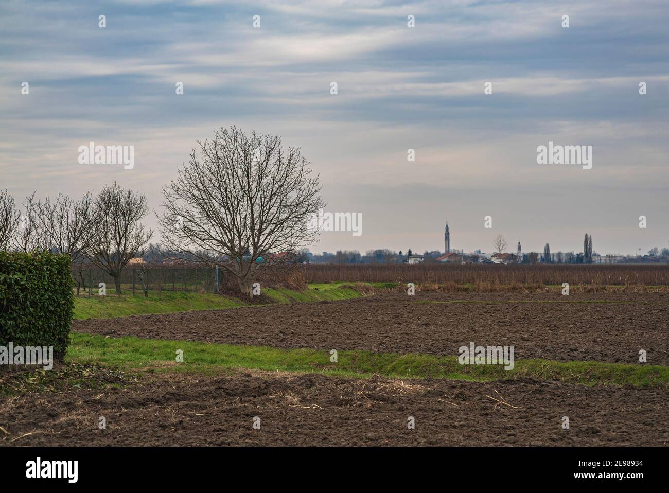 Countryside landscape in winter with blue and cloudy sky Stock Photo ...