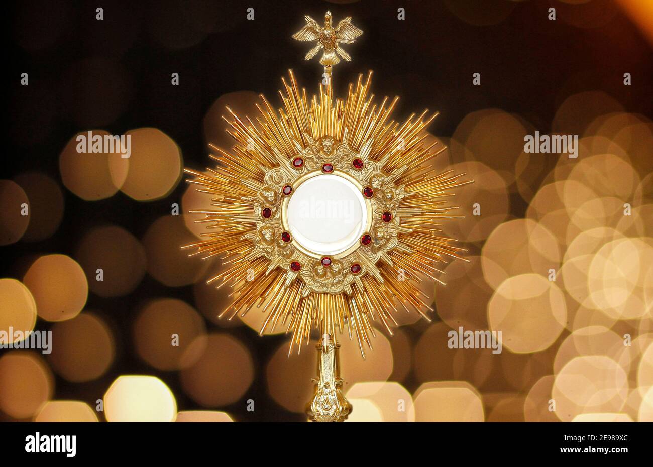 Ostensorium for worship at a Catholic church ceremony - sacred object of devotion and exposure of the Blessed Sacrament Stock Photo