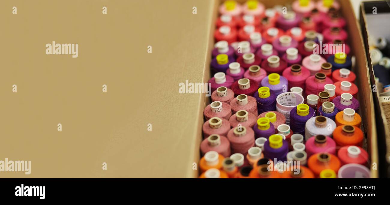 Sewing threads as a multicolored background close up panoramic Stock ...