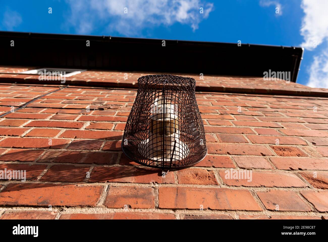 Boiler Flue Cage. attached to a house wall covering a boiler flue. UK Stock Photo