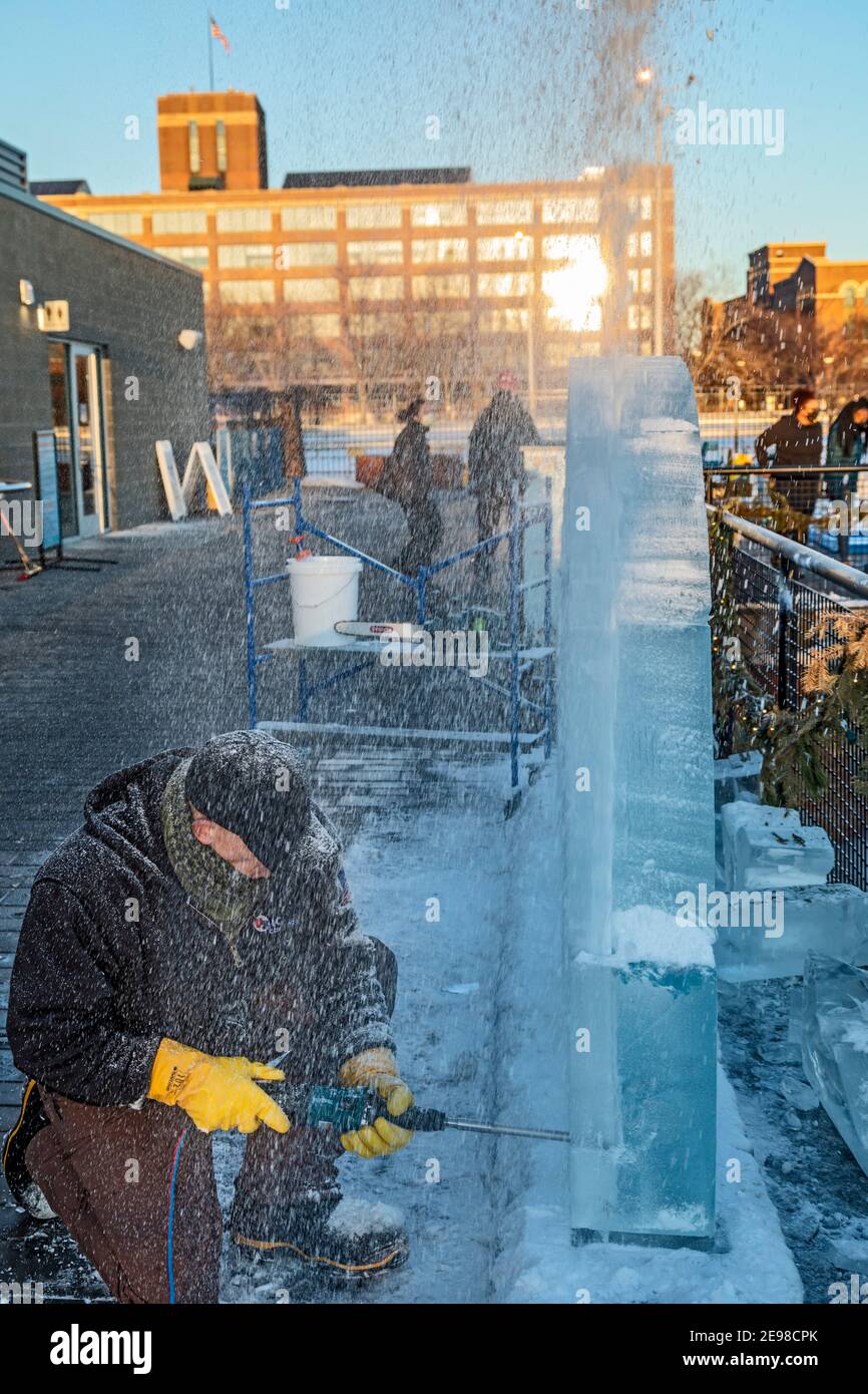 Detroit, Michigan - An ice carver at work at Robert C. Valade Park on the east riverfront. The park, part of the Detroit Riverfront Conservancy, progr Stock Photo