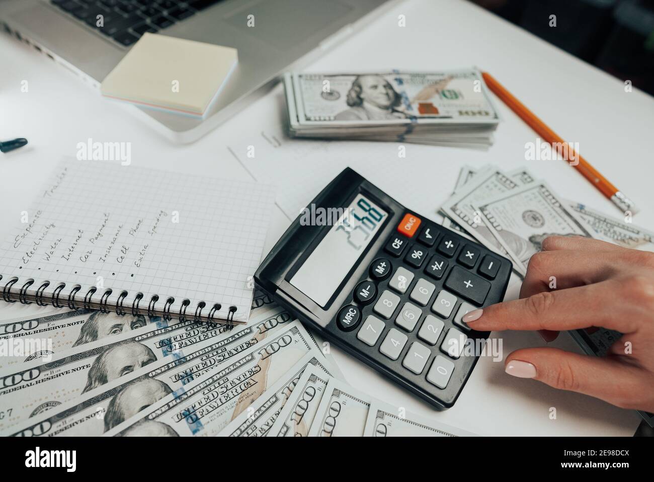 Close-up of old analog calculator. Young woman counts numbers on device,  keeps track of money. Student does homework, teaching mathematics Stock  Photo - Alamy