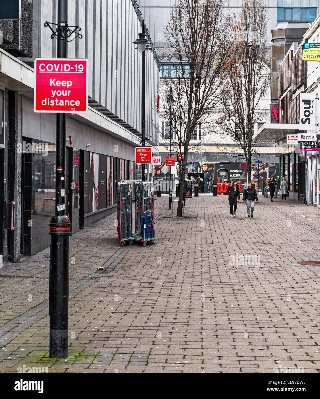 Newcastle upon Tyne city centre during the Coronavirus pandemic with few people, closed shops