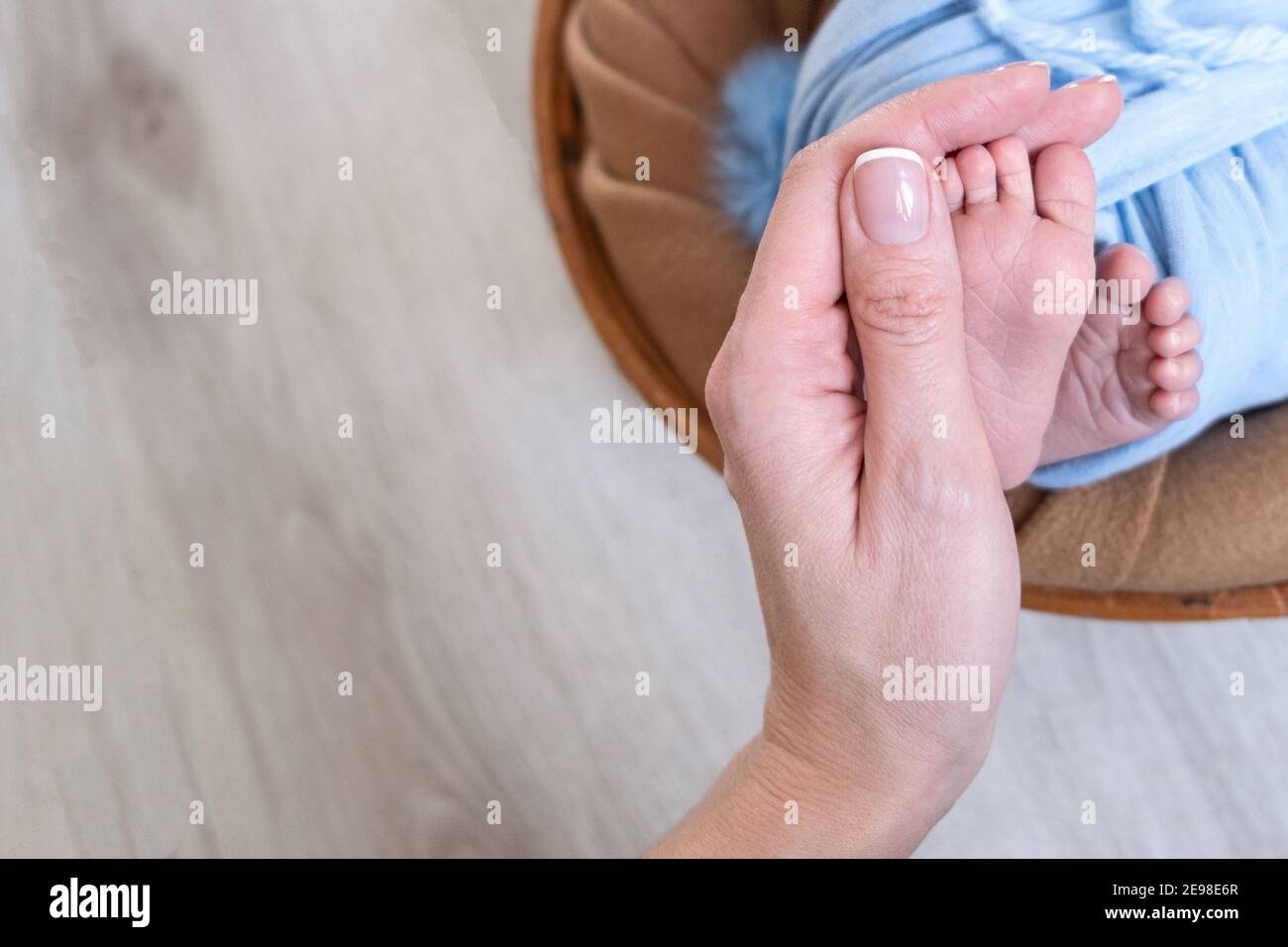 Newborn baby feet. Motherhood concept. Mother day. Copy space. Newborn baby feet. Motherhood concept. Mother day. Copy space. Stock Photo
