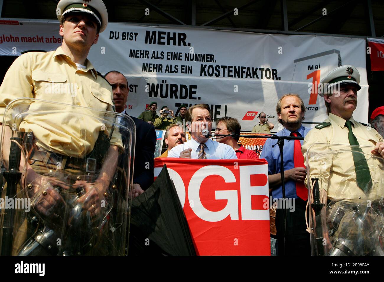 SPD chairman Franz Müntefering has joined the march of the May Day rally of the German Federation of Trade Unions. The destination of the procession is the Landschaftspark Nord in Duisburg, where he spoke amid strong protests from the audience. Flying eggs were repelled by police officers with their shields. Müntefering then takes a tour of the stands of the trade union groups, where he has a beer with some comrades. Stock Photo