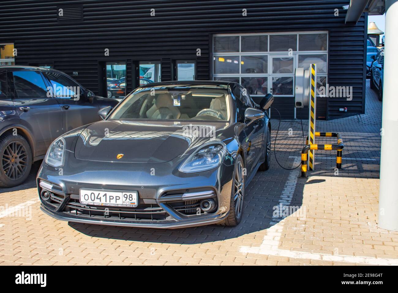 Porsche Turbo hybrid electric car charging with high power charging technology. Russia, Saint-Petersburg. 14 april 2018 Stock Photo