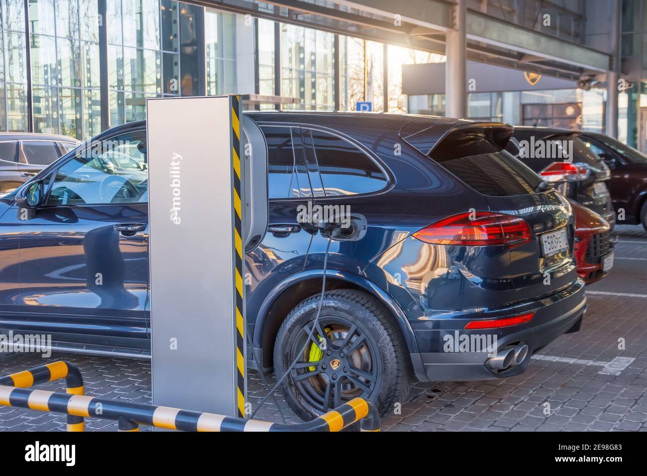 Porsche Turbo hybrid electric car charging with high power charging technology. Russia, Saint-Petersburg. 16 april 2019 Stock Photo