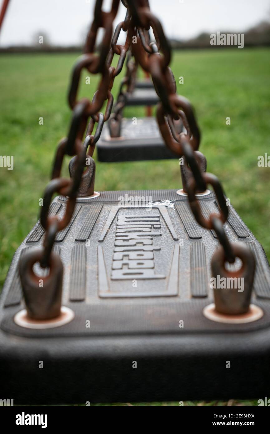 Childrens play swing England UK Stock Photo - Alamy
