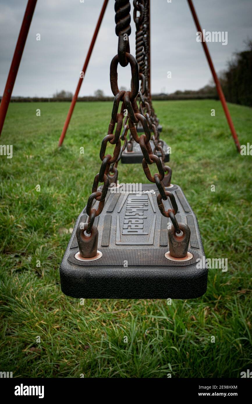 Childrens play swing England UK Stock Photo - Alamy