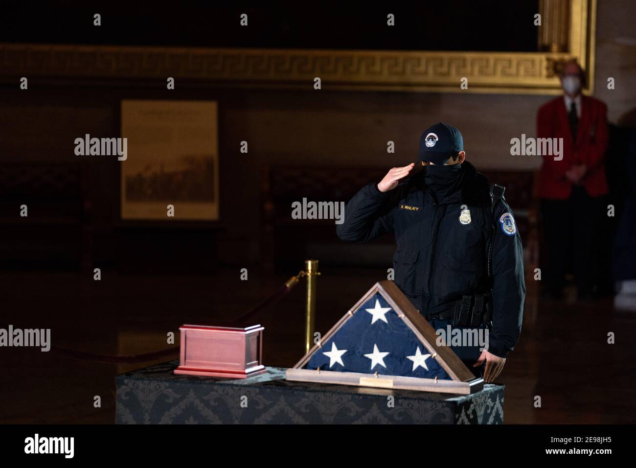 A United States Capitol Police Officer pays his respects to Officer ...