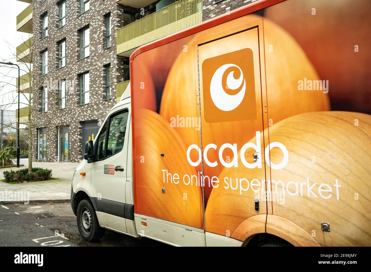London- Ocado delivery truck on residential street in west London- a leading British online supermarket Stock Photo
