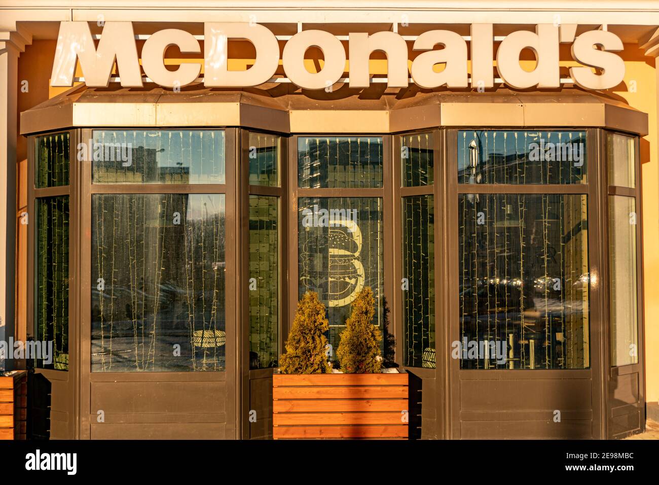 Minsk, Belarus - February 1, 2021: McDonald's sign text and brand logo on Restaurant Exterior of McDonalds fast food Stock Photo