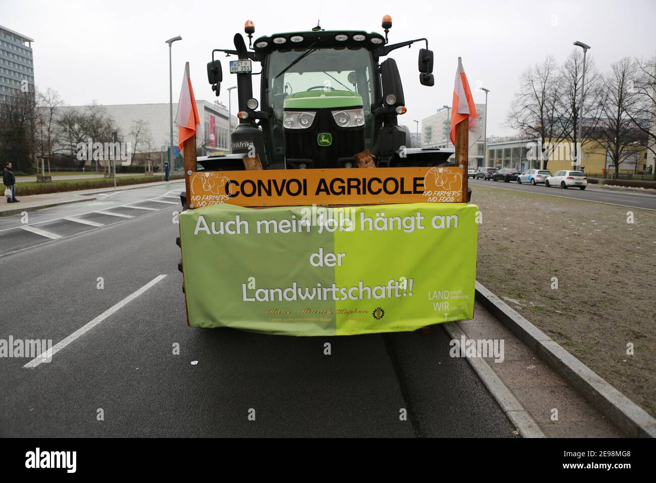 02/03/2021, Berlin, Germany, Demonstration of the farmers on the Karl-Marx-Alle on Alexanderplatz after cost-covering prices and help. Farmers are demanding regulations for cost-covering prices for their products and more domestic food in the trade and that corona and swine fever aid flow immediately. Stock Photo