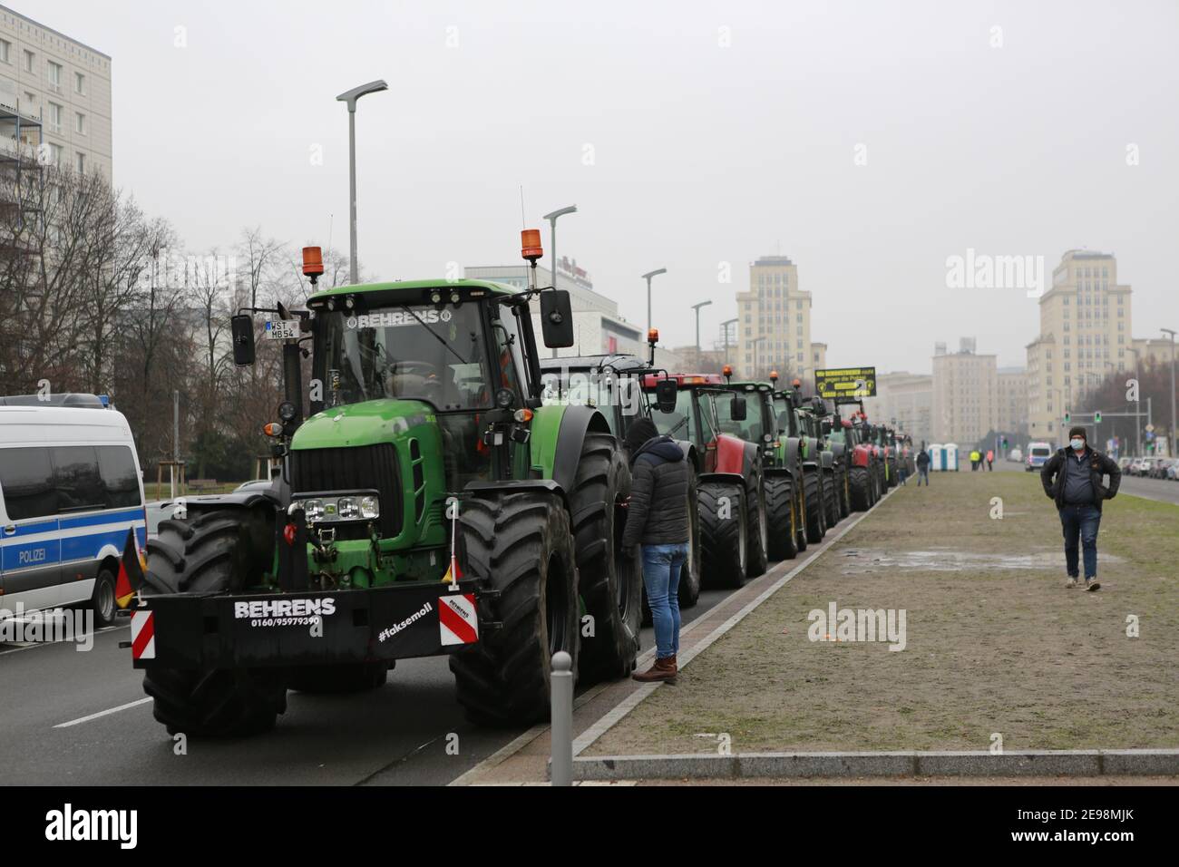 02/03/2021, Berlin, Germany, Demonstration of the farmers on the Karl-Marx-Alle on Alexanderplatz after cost-covering prices and help. Farmers are demanding regulations for cost-covering prices for their products and more domestic food in the trade and that corona and swine fever aid flow immediately. Stock Photo
