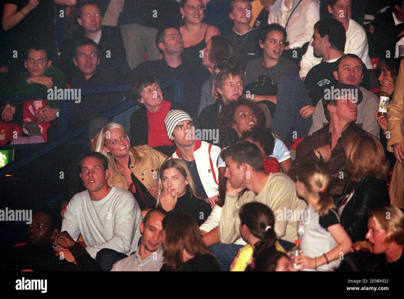 Emma Bunton with her boyfriend sitting next to Melanie Brown aka Mel B with her daughter Phoenix Chi as they watch their former Spice Girl band mate Mel C in concert at Wembley Arena in London, UK. 5th November 2000 Stock Photo