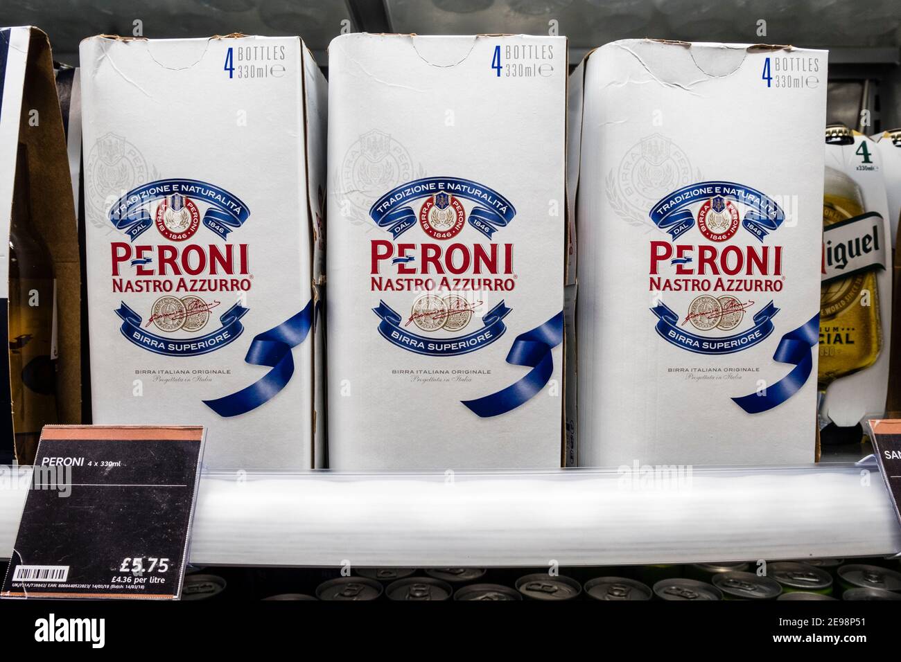 Packs of Peroni lager beer in a supermarket chiller cabinet Stock Photo
