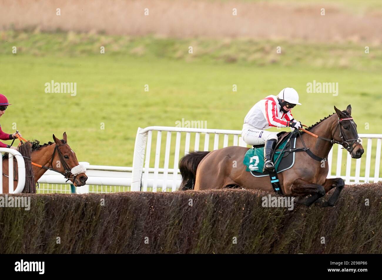 Bridget Andrews riding Latenightpass (right) on their way to winning the Willoughby De Broke Open Hunters' Chase at Warwick Racecourse. Picture date: Wednesday February 3, 2021. Stock Photo