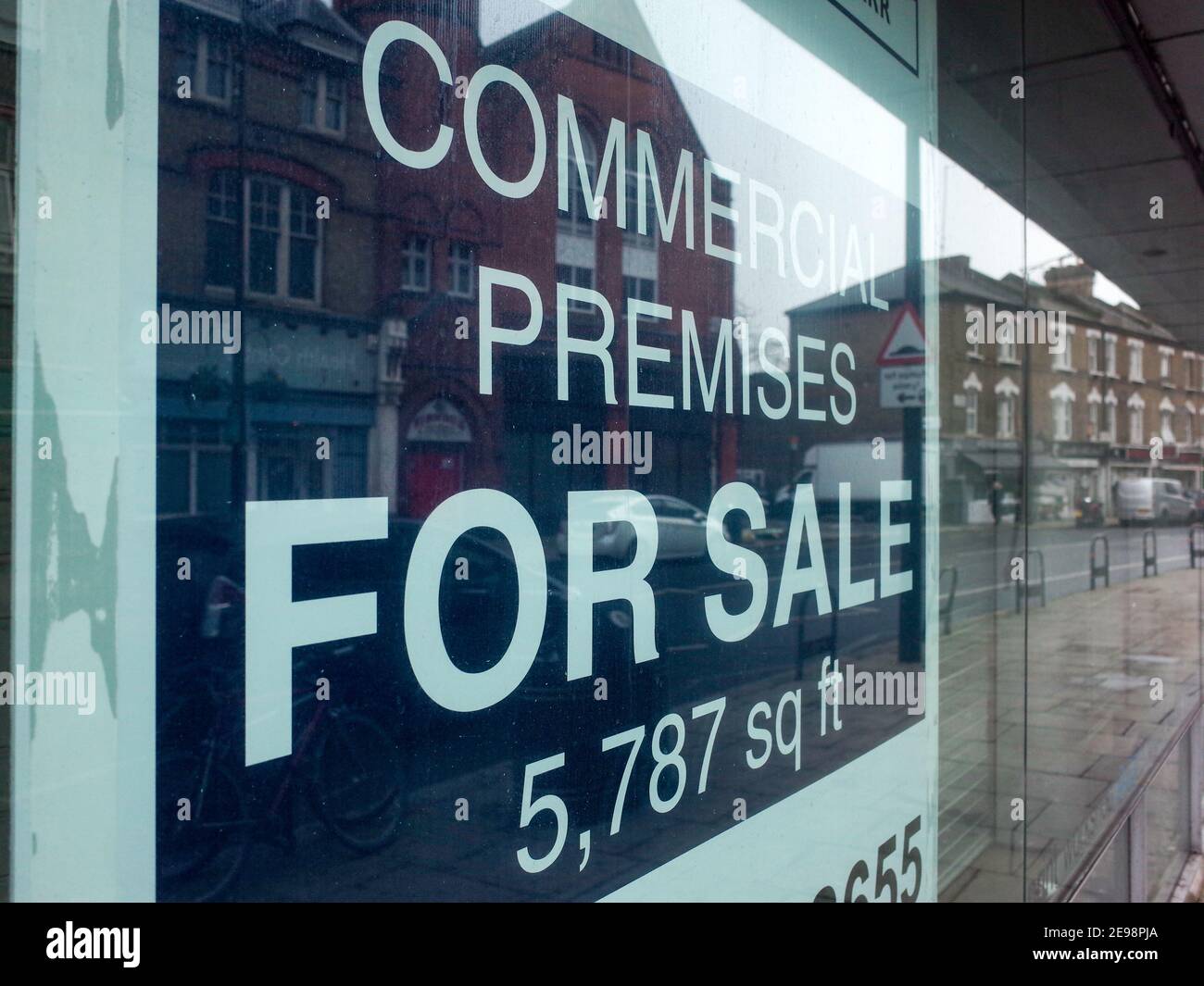 London Commercial Premises for sale sign in retail shop window on Harrow Road, West London