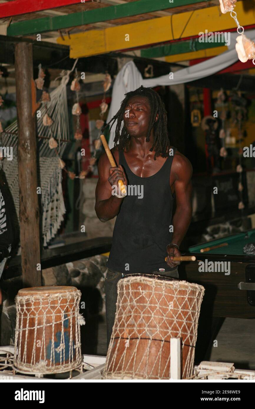 Music is often available at local restaurants. Drumming is popular. Stock Photo