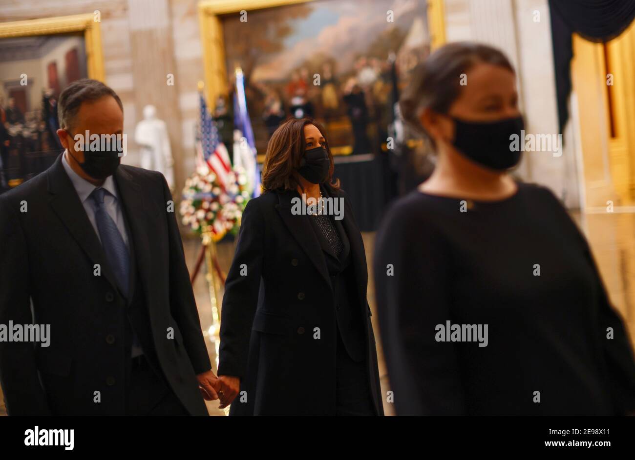 Washigton, USA. 03rd Feb, 2021. U.S. Vice President Kamala Harris and her husband Doug Emhoff pay their respects as the remains of Capitol Police officer Brian Sicknick lay in honor in the Rotunda of the U.S. Capitol building after he died on Jan. 7 from injuries he sustained while protecting the U.S. Capitol during the Jan. 6 attack on the building, in Washington, DC, U.S. February 3, 2021. (Photo by Carlos Barria/Pool/Sipa USA) Credit: Sipa USA/Alamy Live News Stock Photo