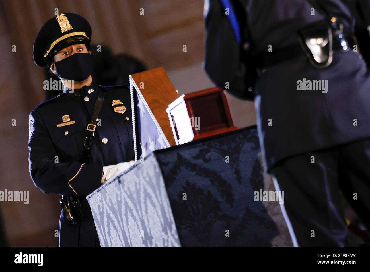 Washigton, USA. 03rd Feb, 2021. U.S. Capitol Police officers stand guard, as the remains of Capitol Police officer Brian Sicknick lay in honor in the Rotunda of the U.S. Capitol building after he died on Jan. 7 from injuries he sustained while protecting the U.S. Capitol during the Jan. 6 attack on the building, in Washington, DC, U.S. February 3, 2021. (Photo by Carlos Barria/Pool/Sipa USA) Credit: Sipa USA/Alamy Live News Stock Photo