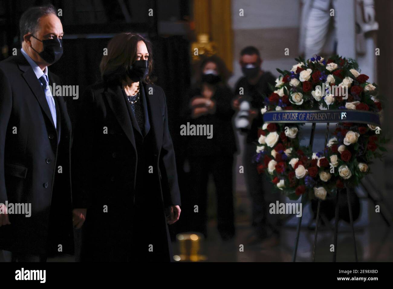 Washigton, USA. 03rd Feb, 2021. U.S. Vice President Kamala Harris and her husband Doug Emhoff pay their respects as the remains of Capitol Police officer Brian Sicknick lay in honor in the Rotunda of the U.S. Capitol building after he died on Jan. 7 from injuries he sustained while protecting the U.S. Capitol during the Jan. 6 attack on the building, in Washington, DC, U.S. February 3, 2021. (Photo by Carlos Barria/Pool/Sipa USA) Credit: Sipa USA/Alamy Live News Stock Photo