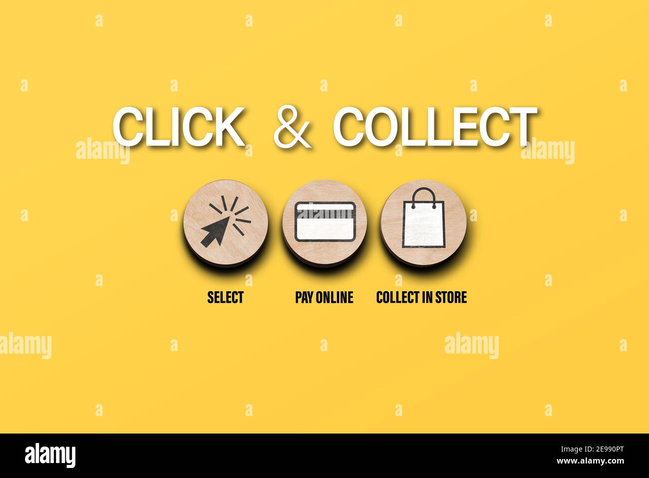 click and collect concept with symbols on round wooden discs on orange background, buying online and picking up in local store Stock Photo