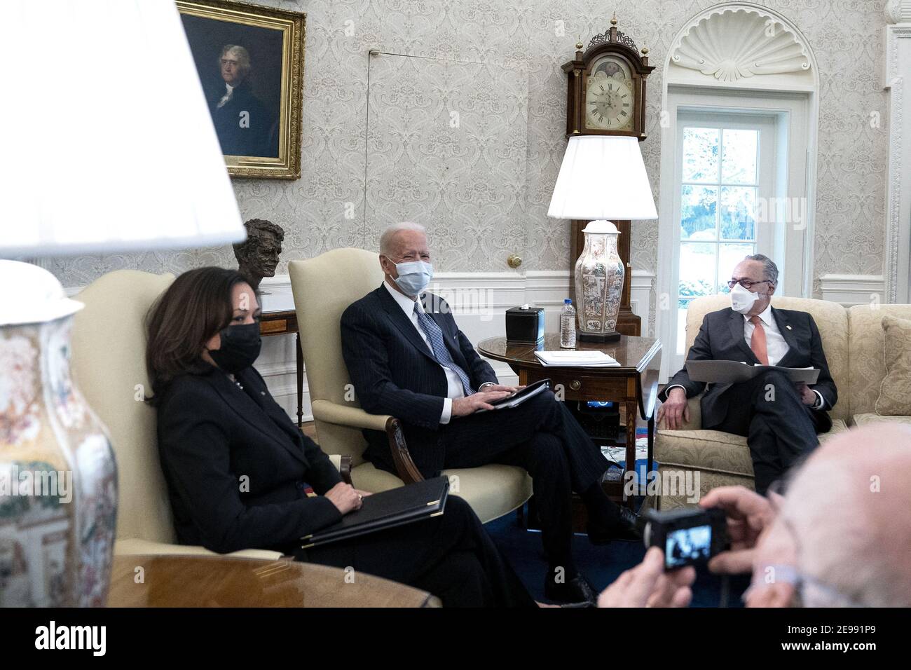 Senator Patrick Leahy (D-VT) takes a photo of President Joe Biden, center, during a meeting to discuss the American Rescue Plan in the Oval Office of the White House in Washington on Wednesday, February 3, 2021. (Stefani Reynolds/The New York Times) Stock Photo