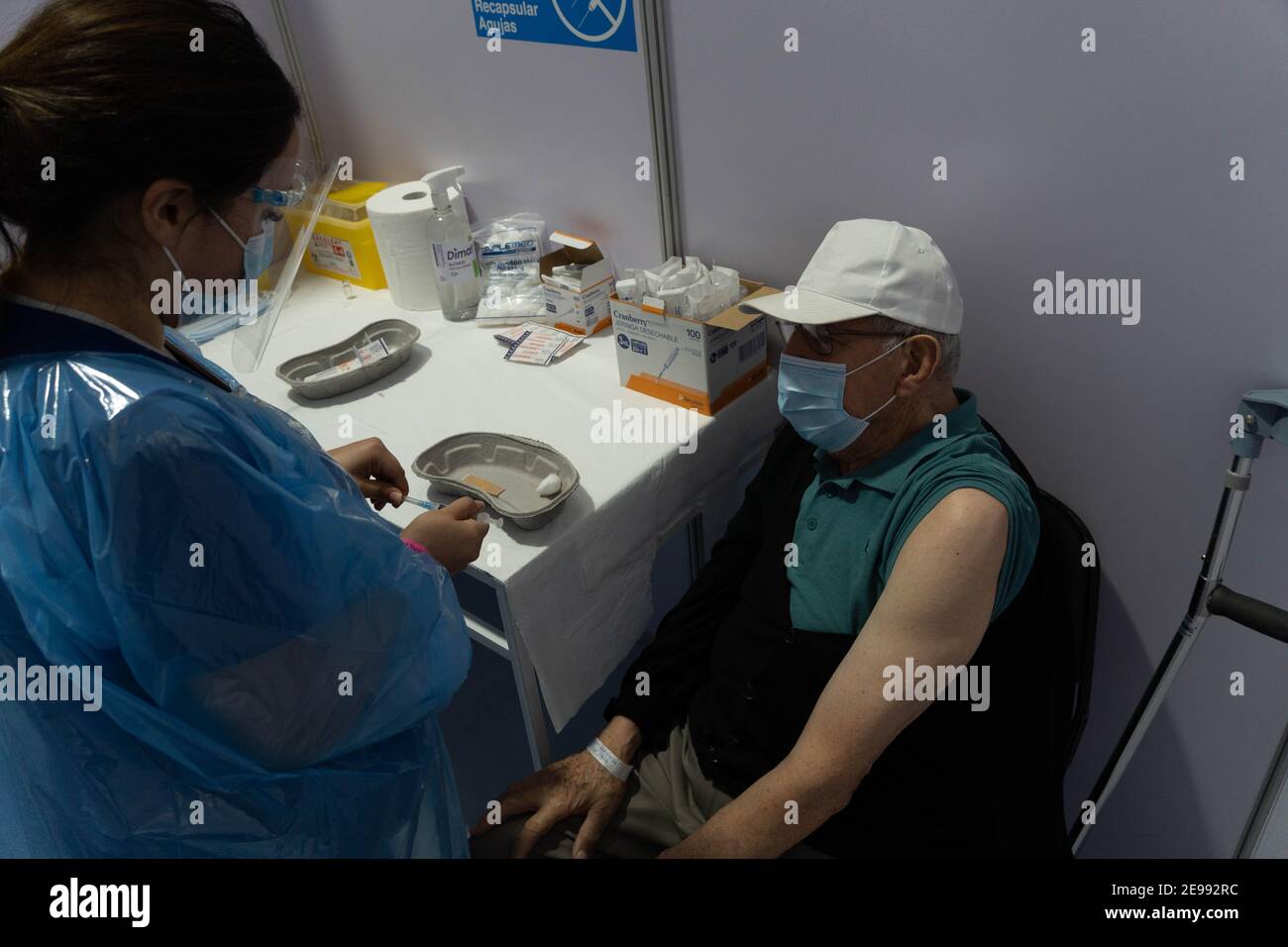 Santiago, Metropolitana, Chile. 3rd Feb, 2021. An older adult is vaccinated with Sinovac, on the first day of mass vaccination against covid in Chile. Credit: Matias Basualdo/ZUMA Wire/Alamy Live News Stock Photo