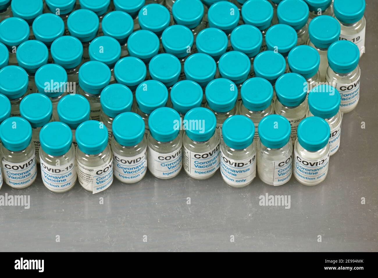 Covid-19 vaccine vials production manufacturing in pharma industry on laboratory shelf Stock Photo