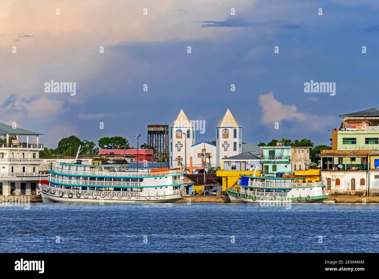 Inland passenger and cargo vessels / ferry boats moored at village along the Madeira River, Rondônia in the upper Amazon River basin, Brazil Stock Photo