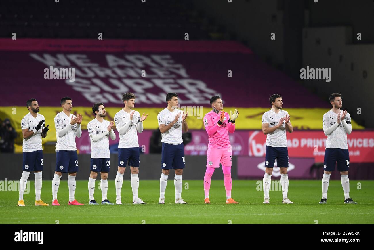 Manchester City players applaud for Captain Sir Tom Moore before the Premier League match at Turf Moor, Burnley. Picture date: Wednesday February 3, 2021. Stock Photo