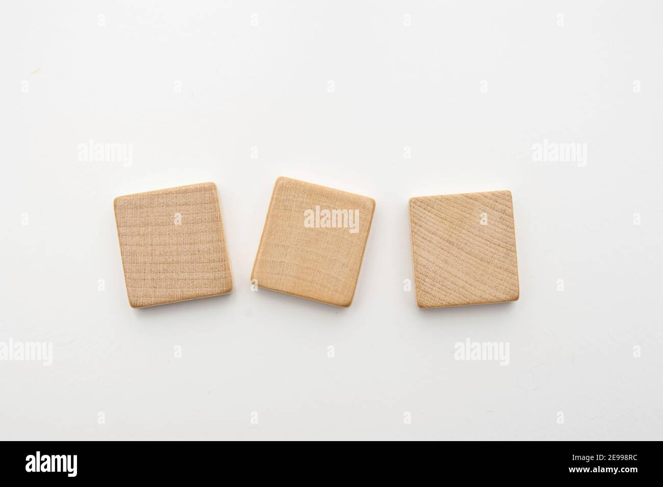 three blank wooden tiles isolated Stock Photo