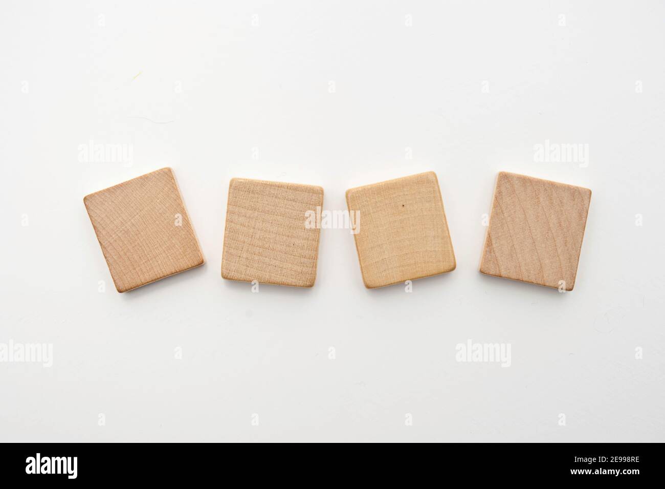 fours blank wooden tiles isolated Stock Photo