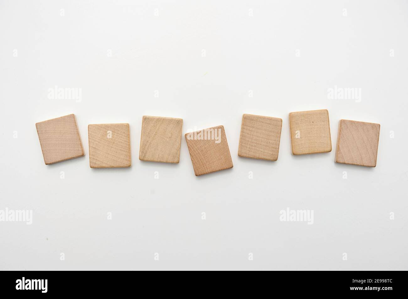 seven blank wooden tiles isolated Stock Photo