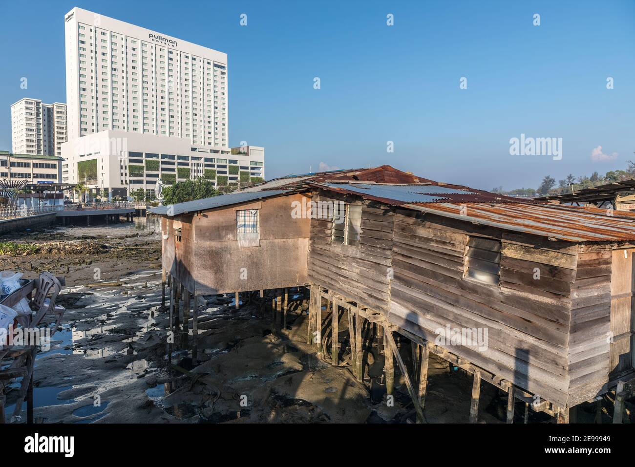 New and old, modern hotel and local shacks used by fishermen, Miri, Malaysia Stock Photo