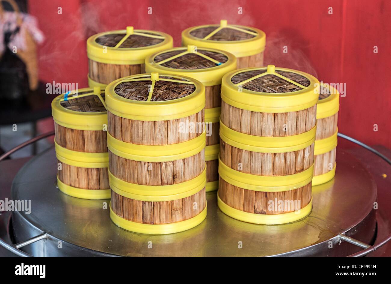 Hot steamed rice in bamboo containers at cafe, Miri, Sarawak, Malaysia Stock Photo